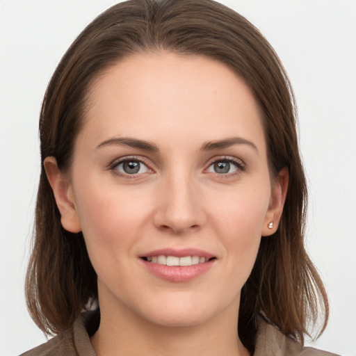 Joyful white young-adult female with long  brown hair and grey eyes