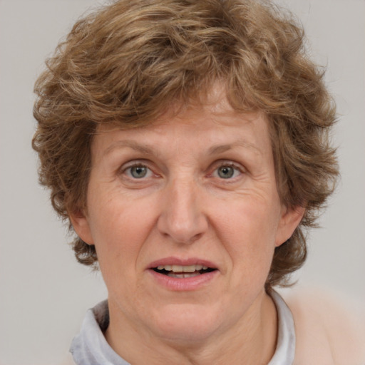 Joyful white middle-aged female with medium  brown hair and brown eyes