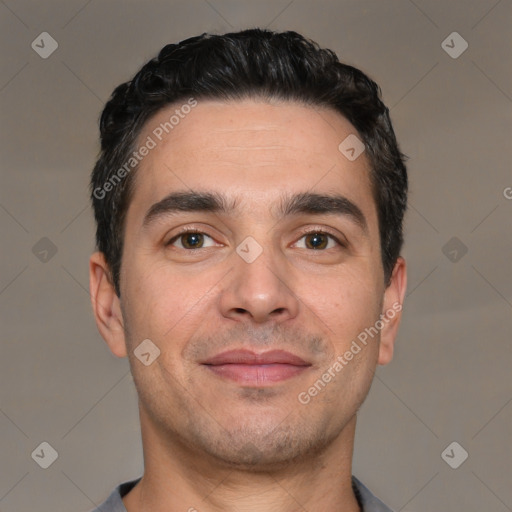 Joyful white young-adult male with short  black hair and brown eyes