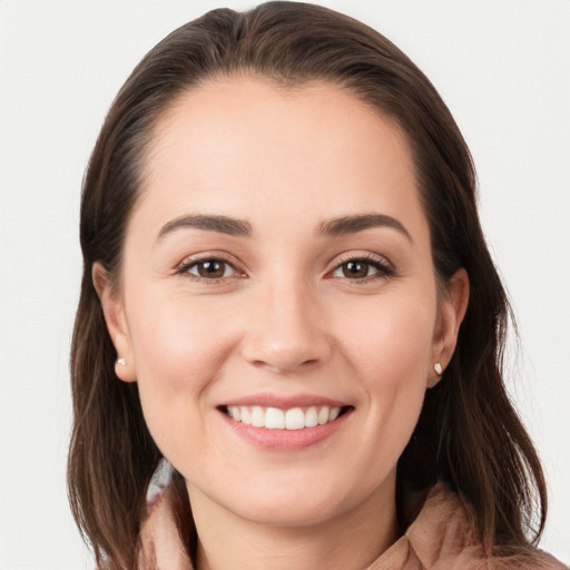 Joyful white young-adult female with long  brown hair and grey eyes