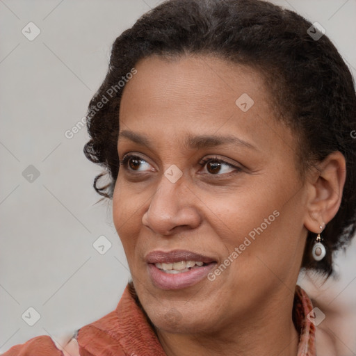 Joyful latino young-adult female with short  brown hair and brown eyes