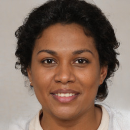 Joyful black adult female with short  brown hair and brown eyes