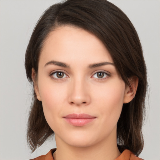 Neutral white young-adult female with medium  brown hair and brown eyes