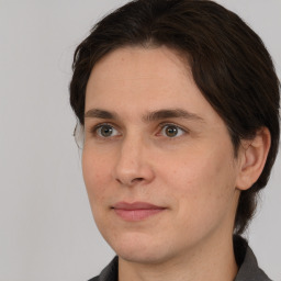 Joyful white young-adult male with medium  brown hair and brown eyes