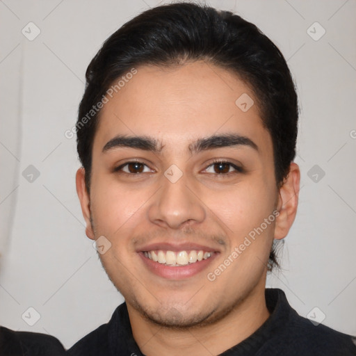 Joyful latino young-adult male with short  black hair and brown eyes