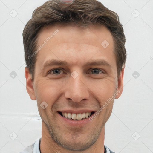 Joyful white adult male with short  brown hair and grey eyes