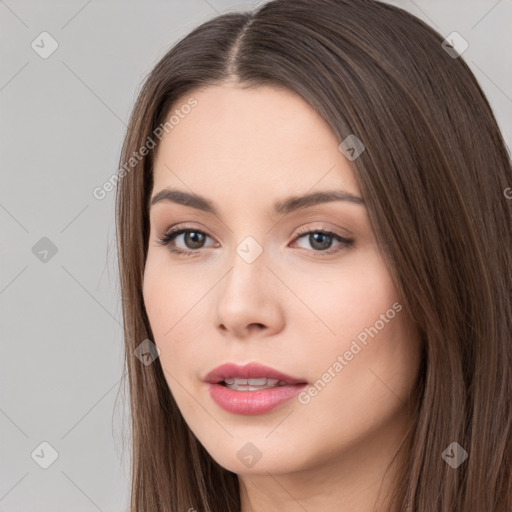 Neutral white young-adult female with long  brown hair and brown eyes