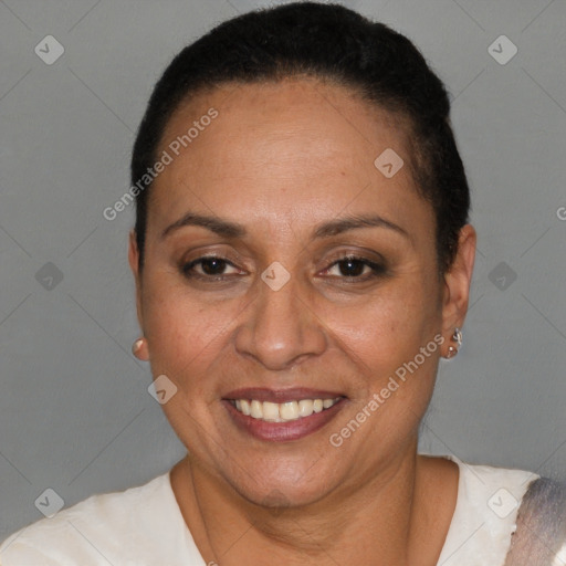 Joyful latino adult female with short  brown hair and brown eyes