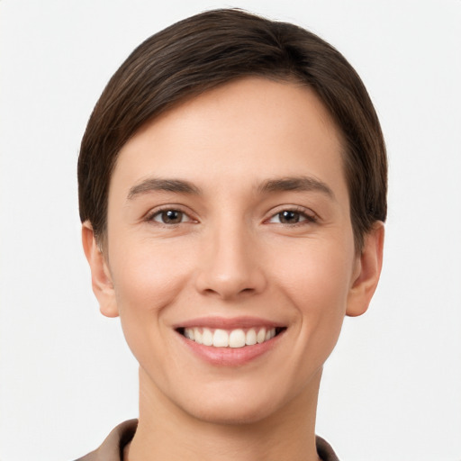 Joyful white young-adult female with short  brown hair and brown eyes