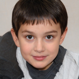 Joyful white child male with short  brown hair and brown eyes