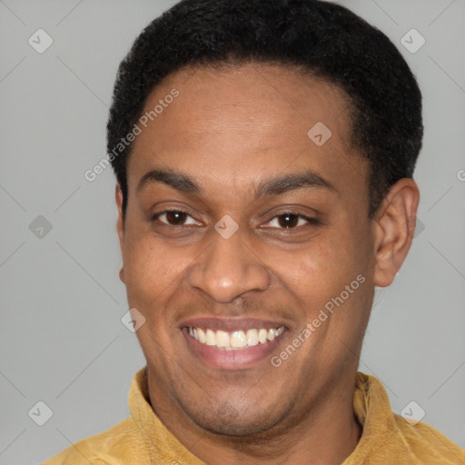 Joyful latino young-adult male with short  brown hair and brown eyes