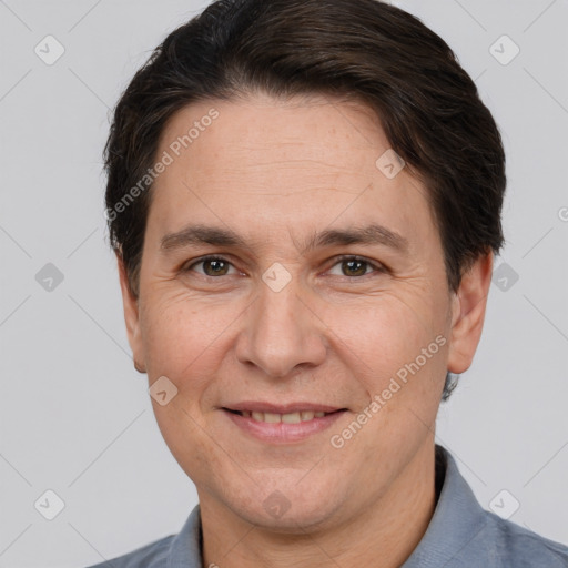 Joyful white adult male with short  brown hair and brown eyes