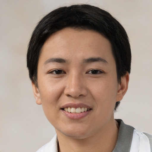 Joyful white young-adult female with short  black hair and brown eyes