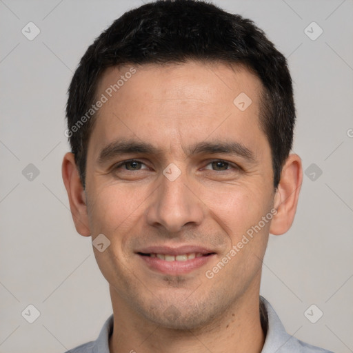 Joyful white young-adult male with short  brown hair and brown eyes