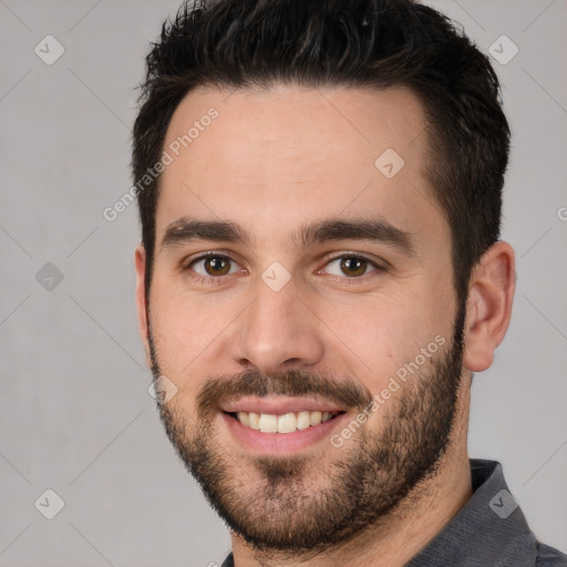 Joyful white young-adult male with short  brown hair and brown eyes