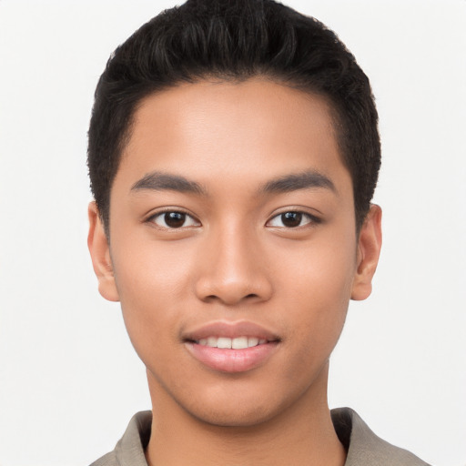 Joyful latino young-adult male with short  black hair and brown eyes