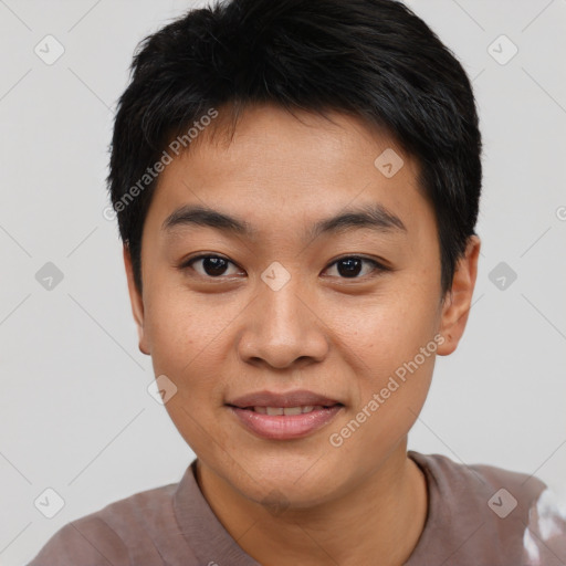 Joyful asian young-adult male with short  black hair and brown eyes