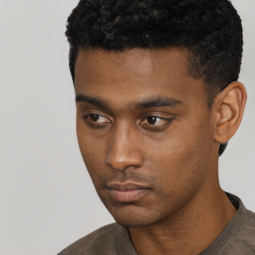 Neutral black young-adult male with short  black hair and brown eyes