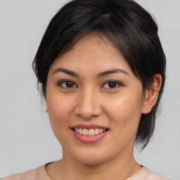 Joyful asian young-adult female with medium  brown hair and brown eyes