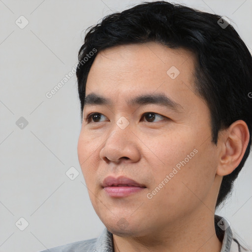 Neutral asian young-adult male with short  black hair and brown eyes