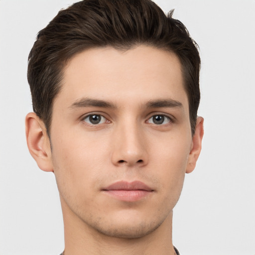 Neutral white young-adult male with short  brown hair and brown eyes