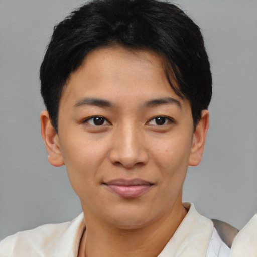 Joyful asian young-adult female with short  brown hair and brown eyes