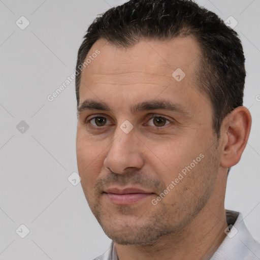 Joyful white adult male with short  brown hair and brown eyes