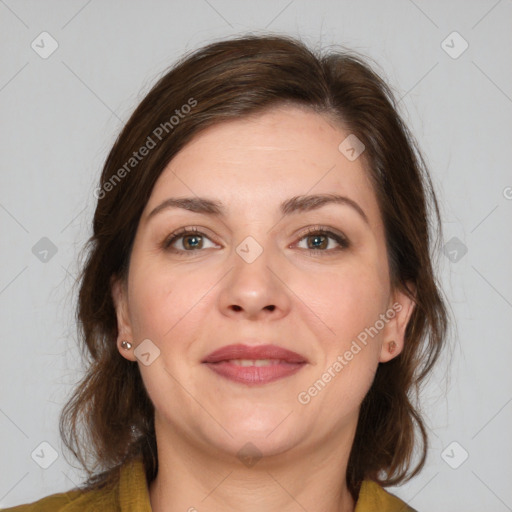 Joyful white adult female with medium  brown hair and brown eyes