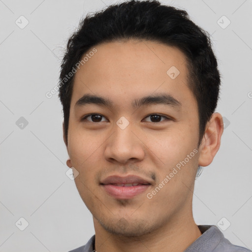 Joyful asian young-adult male with short  black hair and brown eyes