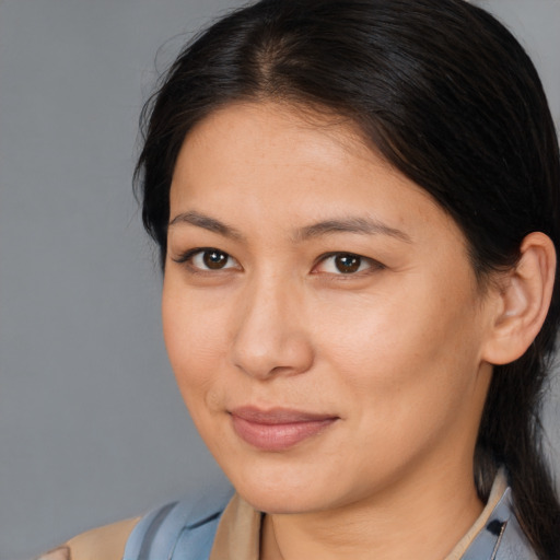 Joyful asian young-adult female with medium  brown hair and brown eyes