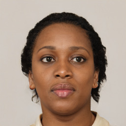 Neutral black young-adult female with short  brown hair and brown eyes