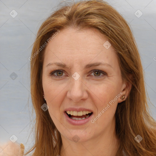 Joyful white adult female with long  brown hair and brown eyes