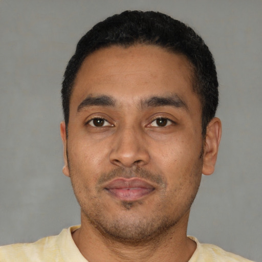 Neutral latino young-adult male with short  black hair and brown eyes