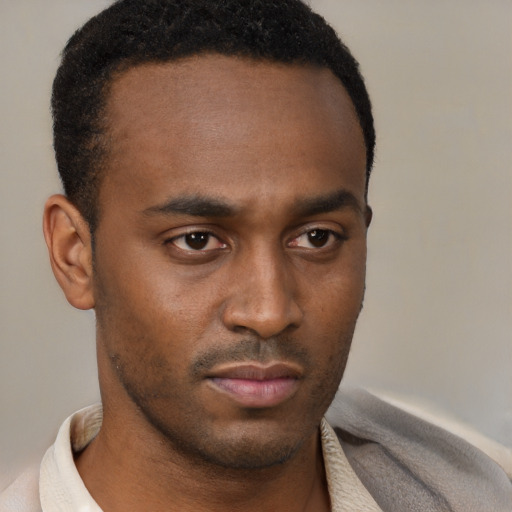 Neutral latino young-adult male with short  brown hair and brown eyes