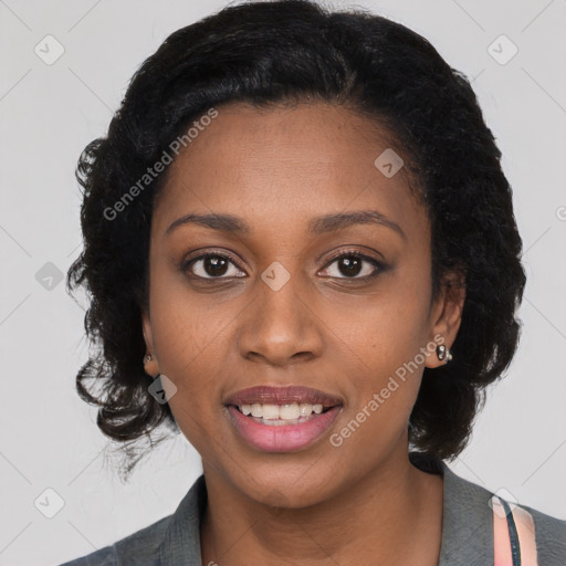 Joyful black young-adult female with long  black hair and brown eyes