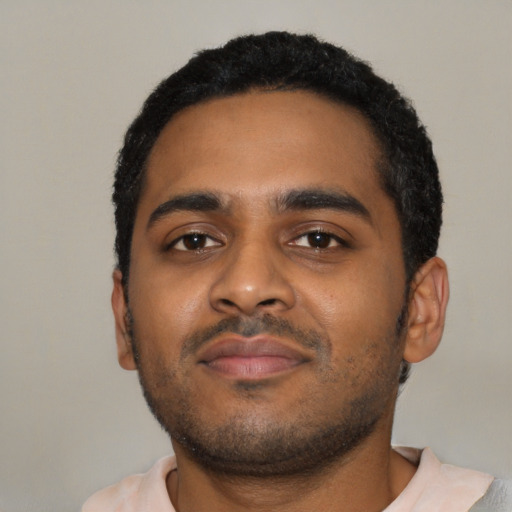 Neutral black young-adult male with short  black hair and brown eyes
