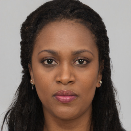 Neutral black young-adult female with long  brown hair and brown eyes