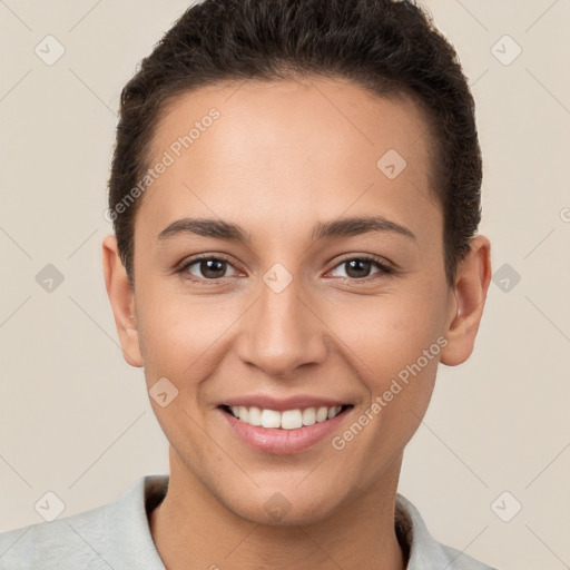 Joyful white young-adult female with short  brown hair and brown eyes