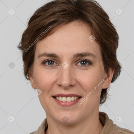 Joyful white adult female with medium  brown hair and grey eyes