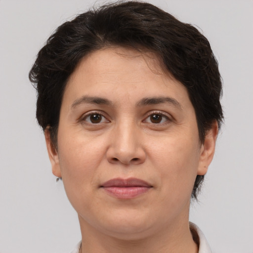 Joyful white adult female with short  brown hair and brown eyes