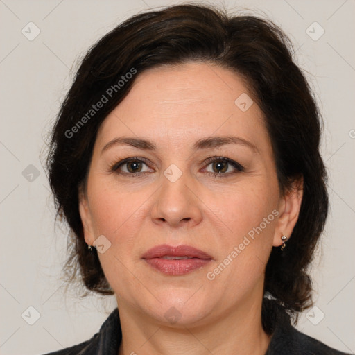 Joyful white adult female with medium  brown hair and brown eyes