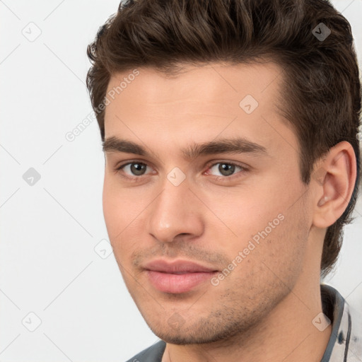 Neutral white young-adult male with short  brown hair and brown eyes