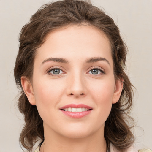 Joyful white young-adult female with medium  brown hair and green eyes