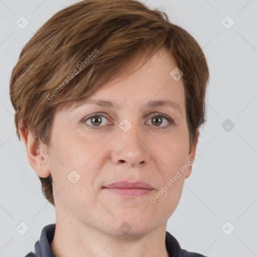 Joyful white adult female with short  brown hair and grey eyes