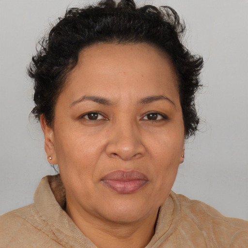 Joyful white adult female with short  brown hair and brown eyes