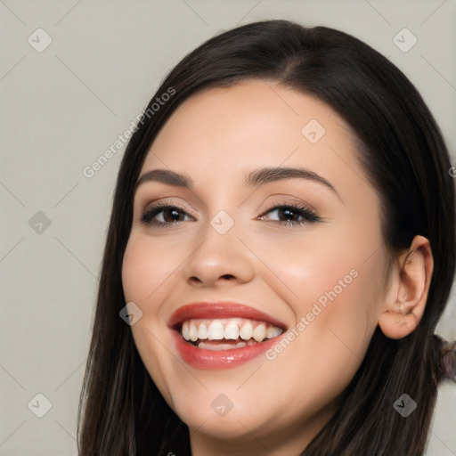 Joyful white young-adult female with long  black hair and brown eyes