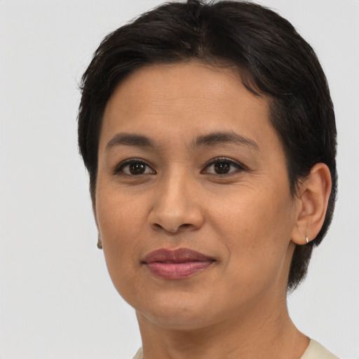 Joyful asian young-adult female with short  brown hair and brown eyes