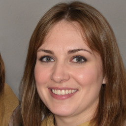 Joyful white adult female with medium  brown hair and brown eyes