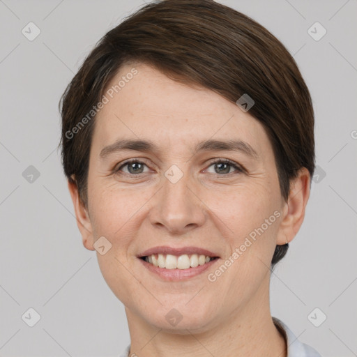 Joyful white young-adult female with short  brown hair and brown eyes