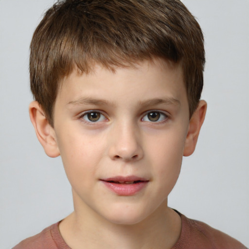 Joyful white child male with short  brown hair and grey eyes